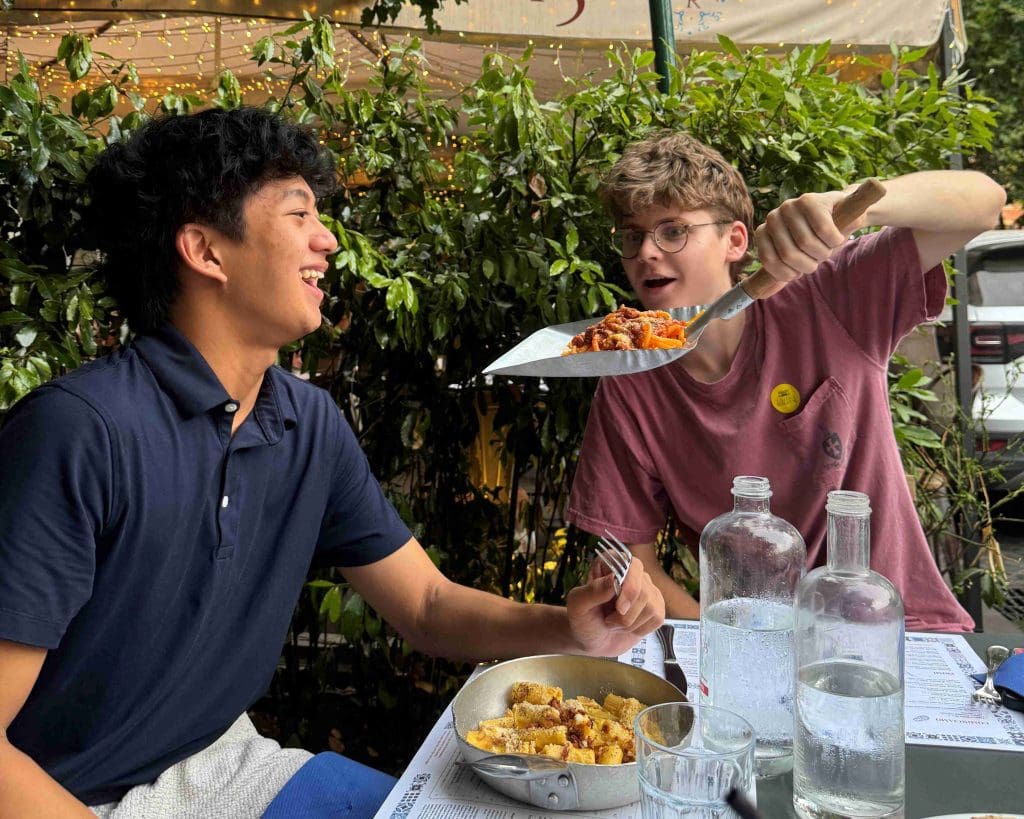 two students having a pasta dinner in Trastevere